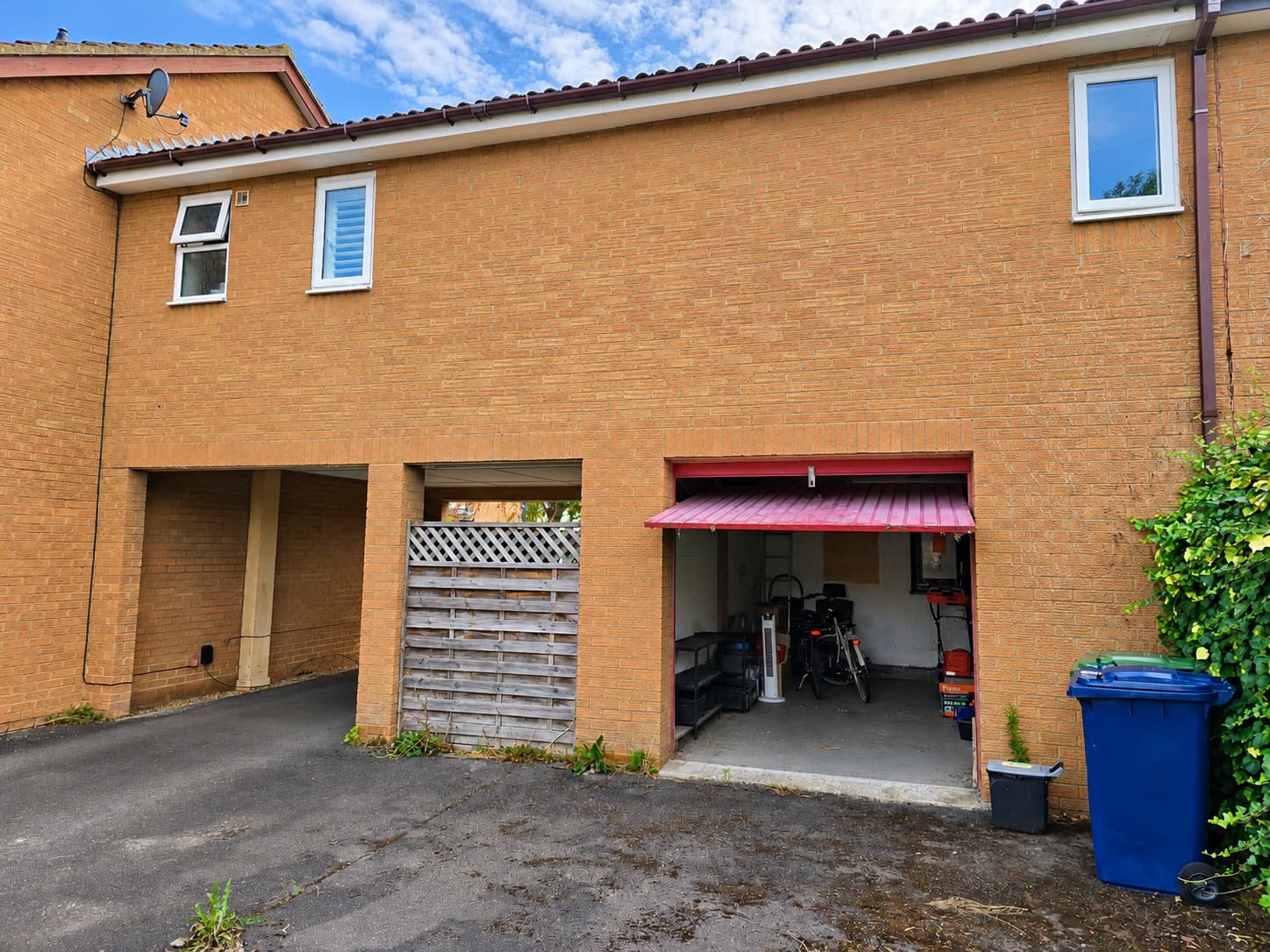 Suburban Brick Facade with Open Garage bays